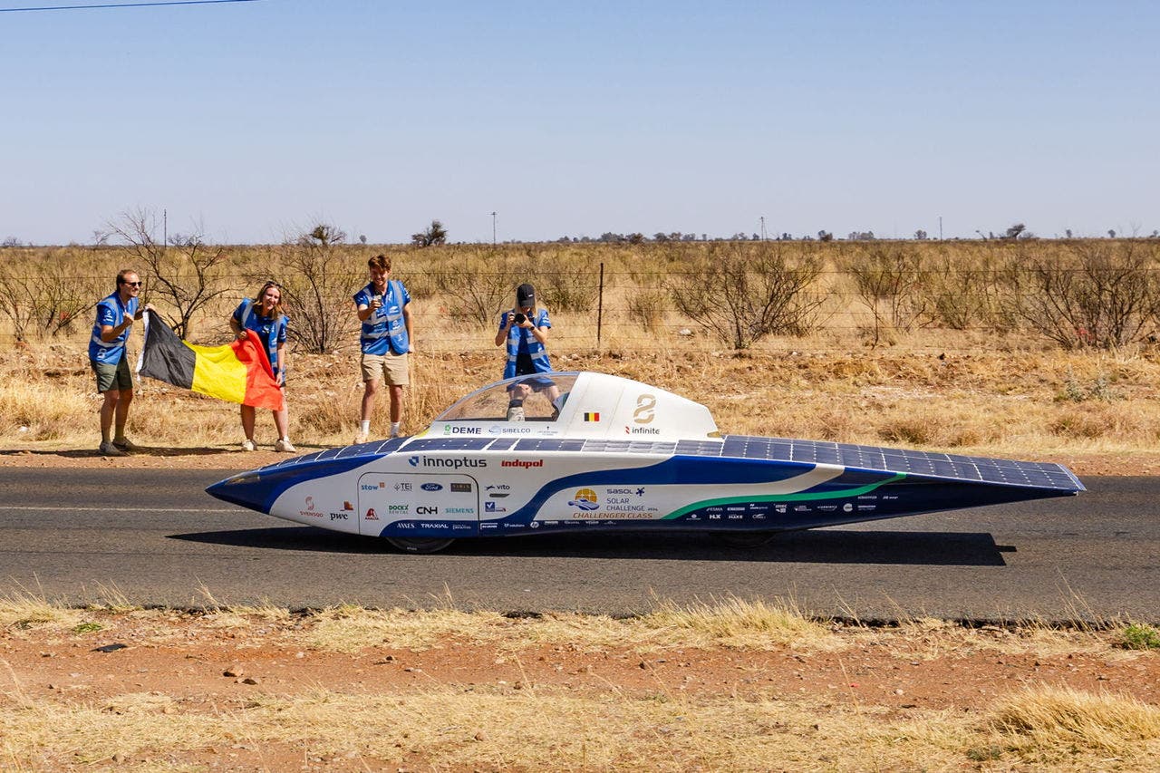 Student team cheering on their solar racing car.