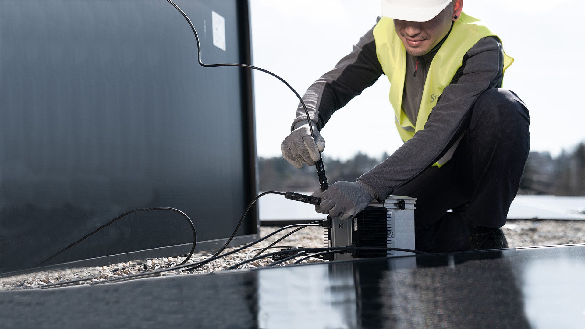 PV specialist installing MC4 connector