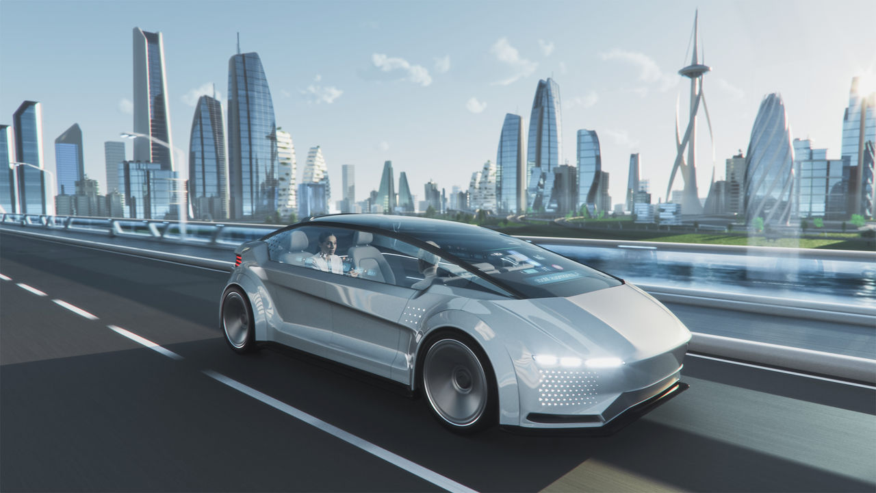 Shot of a Futuristic Self-Driving Van Moving on a Public Highway in a Modern City with Glass Skyscrapers. Beautiful Female and Senior Man are Having a Conversation in a Driverless Autonomous Vehicle.